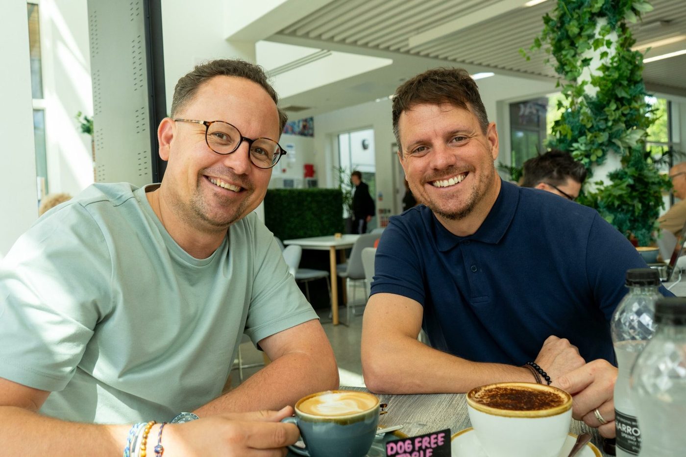 Adam Mackay and Jamie Fisher at a coffee table